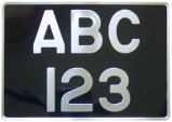 Old style motorcycle number plate